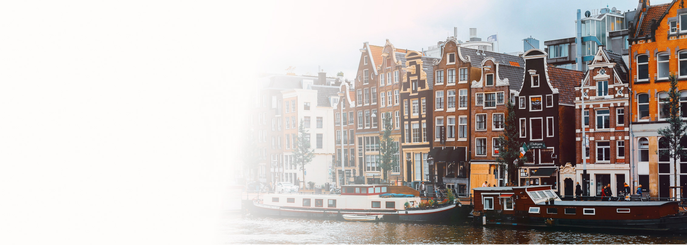 Amsterdam canal houses representing ING Bank's agile transformation through Core Leadership Institute's Purpose to Impact program