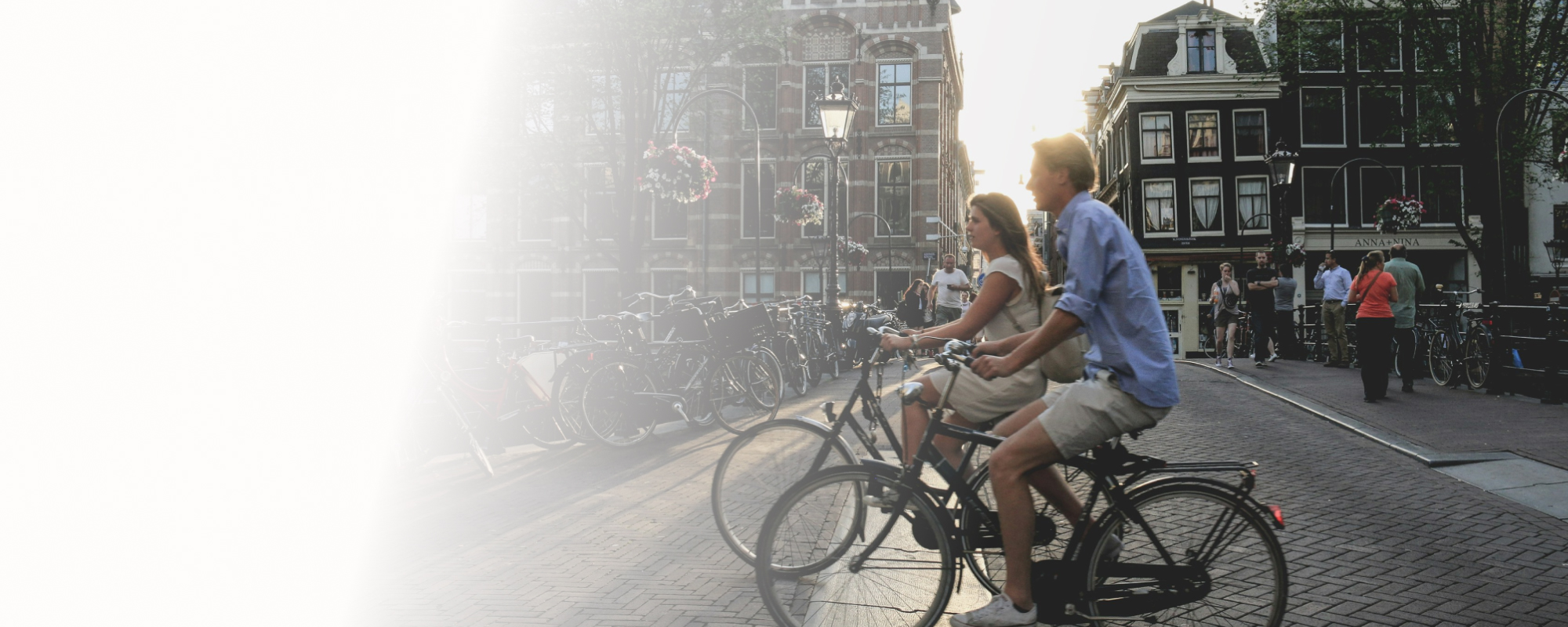 People cycling in Amsterdam representing ING Bank's employee wellbeing program through Core Leadership Institute